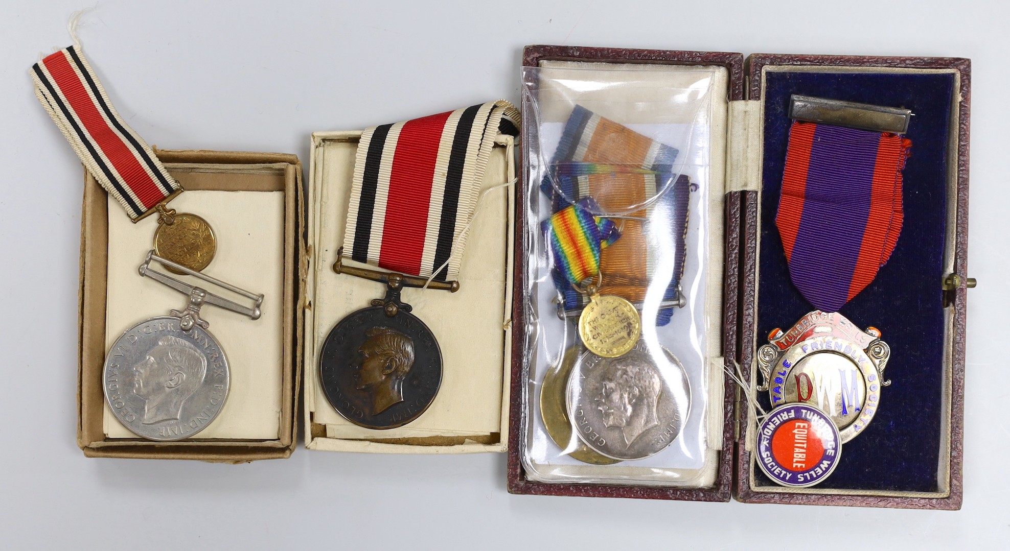 A WWI and WWII Special Constabulary group to PTE. G. HARRINGTON R. SUSSEX R and Special Constabulary for Faithful Service in Brighton Special Constabulary and WWII Defence Medal with silver and enamel masonic medal